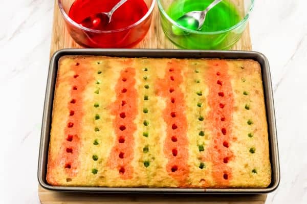 how to pour the jello in a Christmas Jello Poke Cake