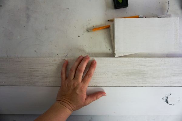 gluing boards together for a DIY Tis the Season Porch Leaner Sign