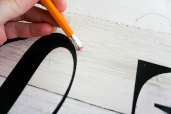 how to erase the lines off a DIY Tis the Season Porch Leaner Sign