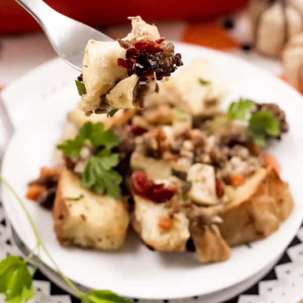 taking a bite of Easy Cranberry Sausage Stuffing