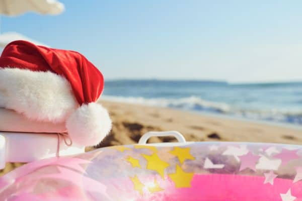 Christmas in July Santa hat on a beach