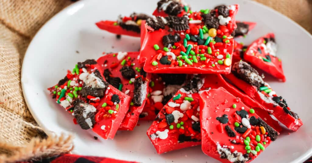 close up picture of red Christmas bark candy with oreos and sprinkles