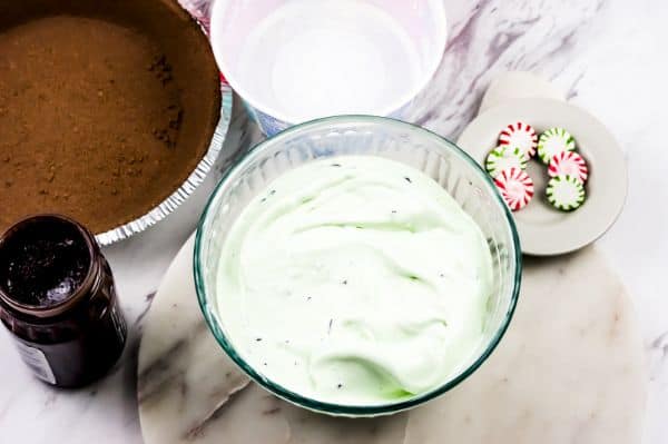 bowls of ingredients to make a chocolate mint ice cream pie