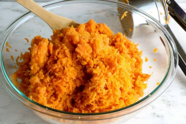 bowl of cooked and mashed sweet potatoes