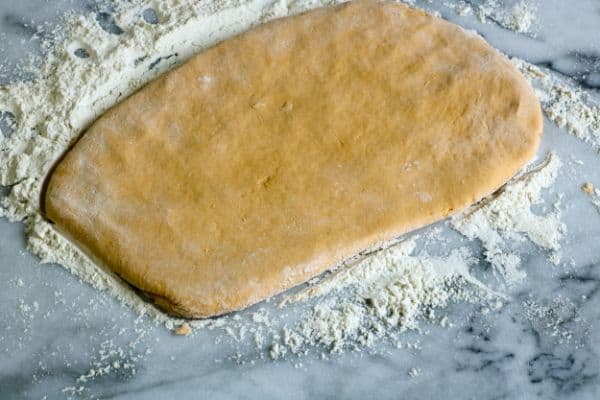 sweet potato biscuit dough rolled out on counter