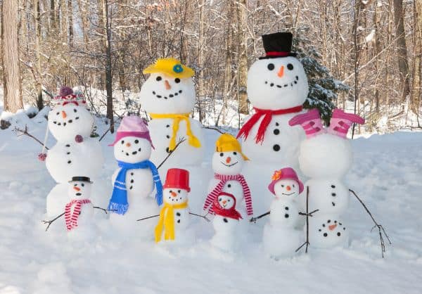 large family of snowmen with brightly colored scarves