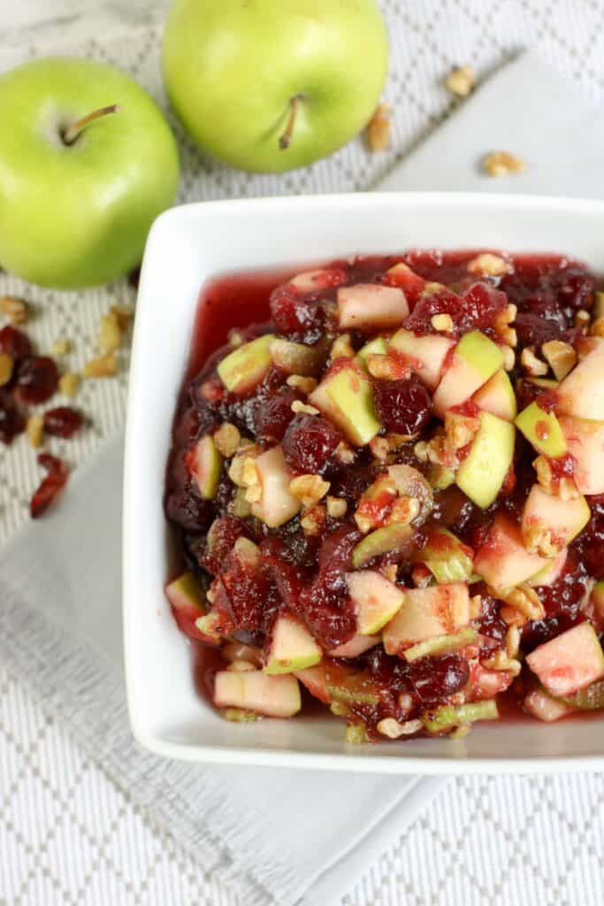 overhead view of a bowl of holiday cranberry salad with apples