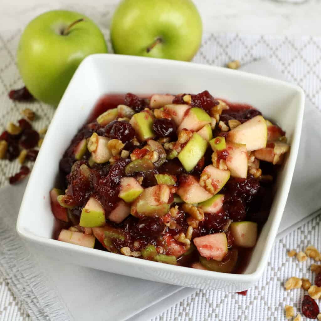 close up view of a bowl of cranberry apple celery salad