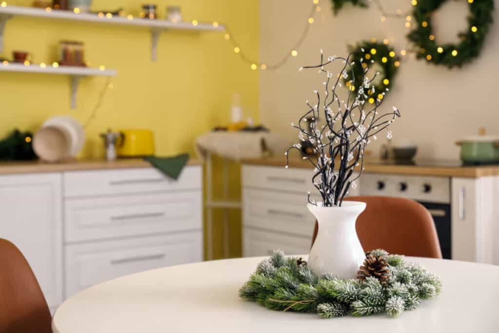 kitchen table with a simple vase and greenery