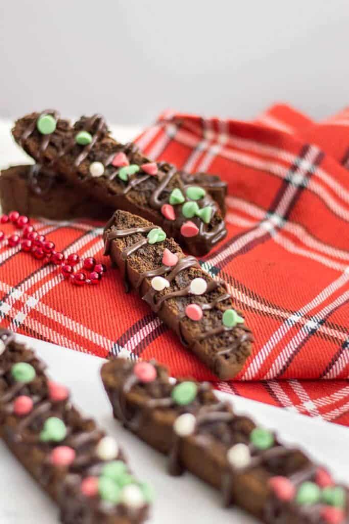 sticks of choco biscotti on a red checkered cloth