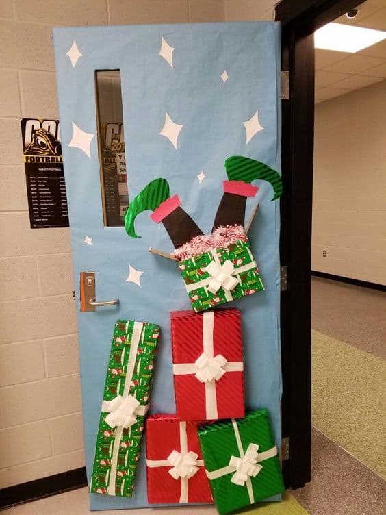 Stack of gifts with an elf feet on top