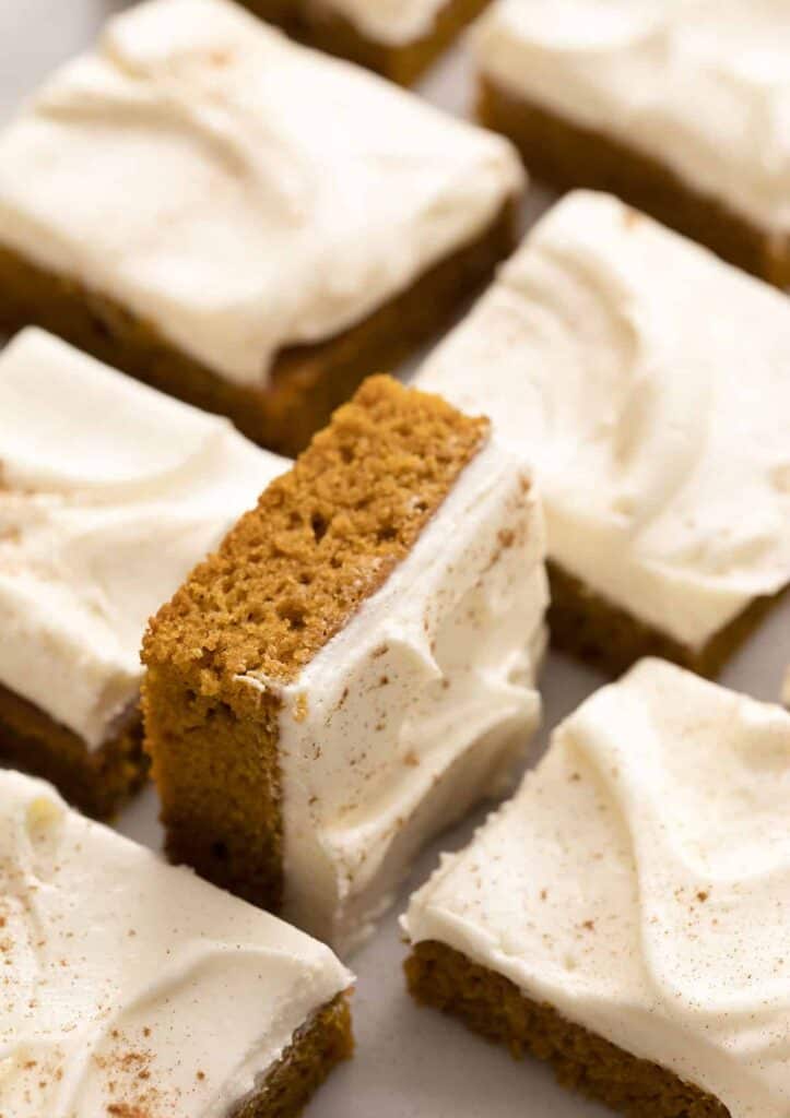 slices of pumpkin bars with frosting