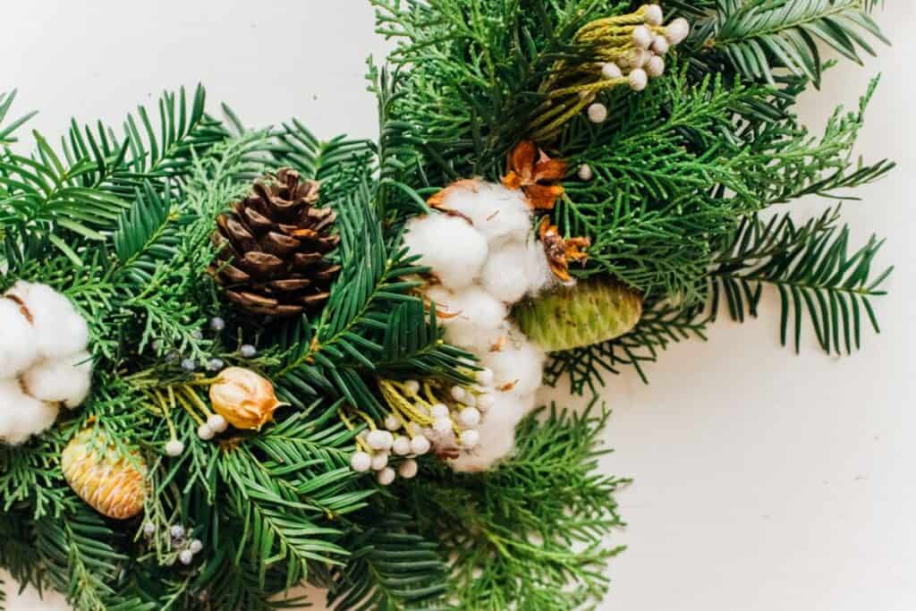 artificial Christmas tree branch turned into a table centerpiece