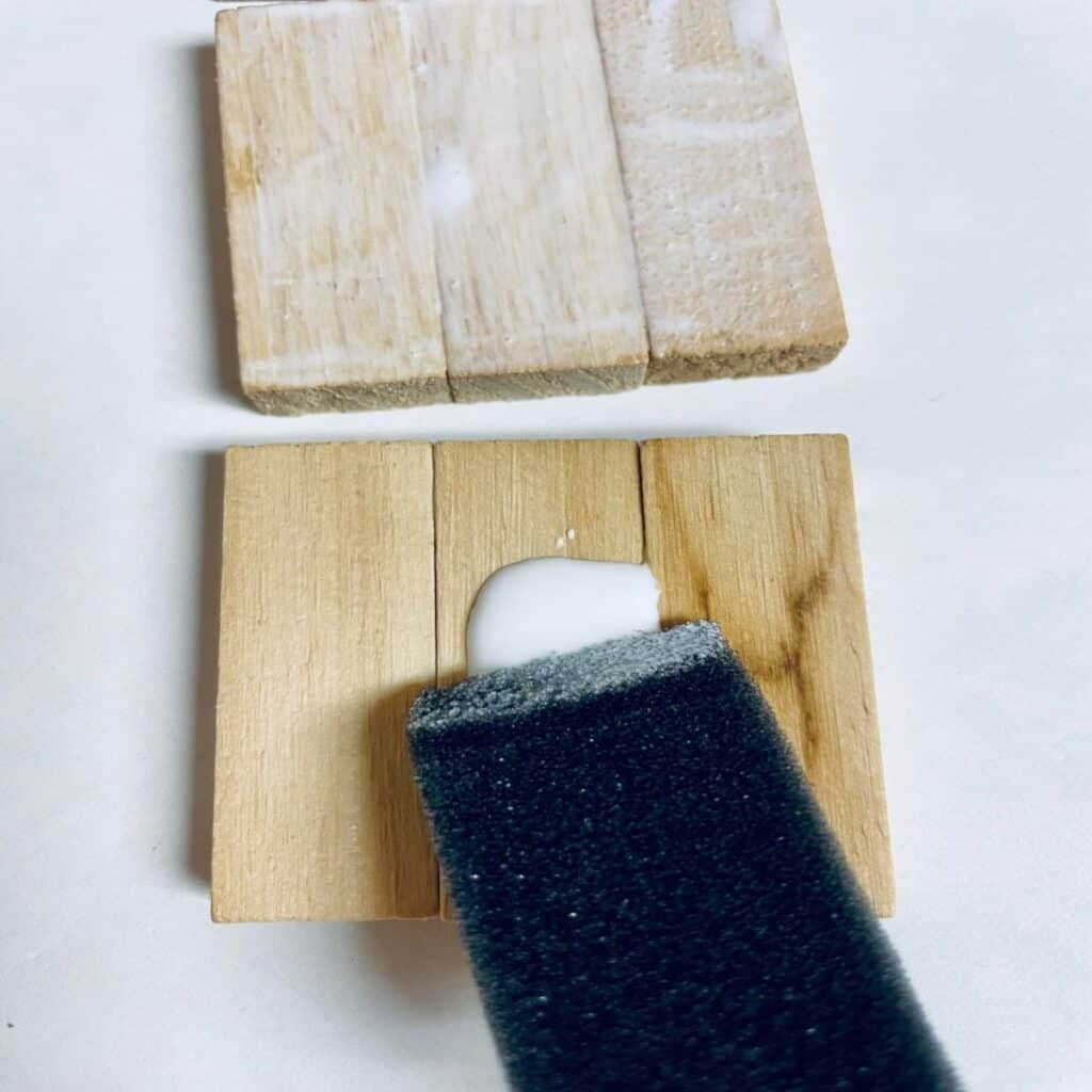 Spreading Wood glue on Jenga Pieces