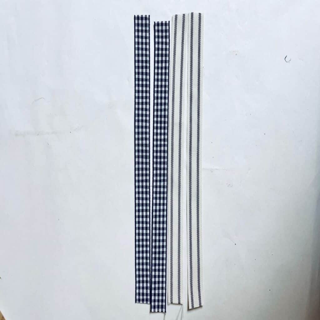 2 checkered ribbons and 2 striped ribbons