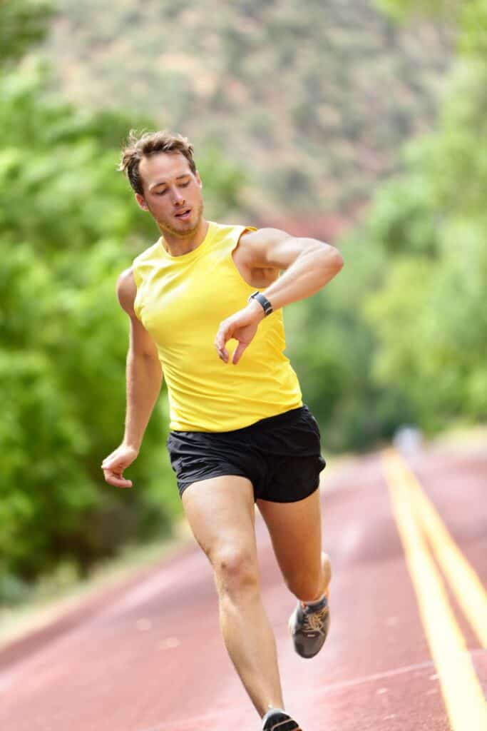 man running looking at his watch