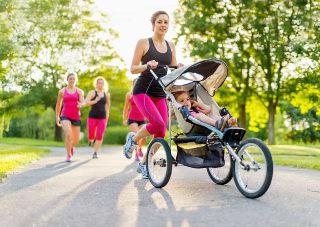 woman running pushing jogging stroller