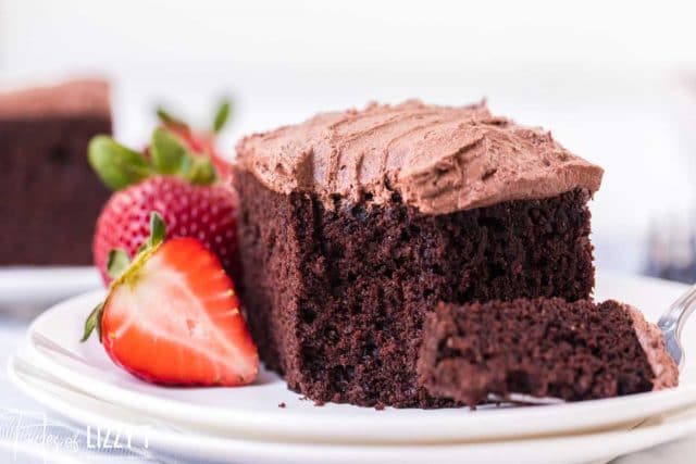 Yummy mayonnaise cake on a plate with strawberries