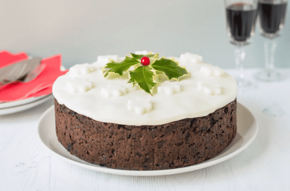 Whole traditional Christmas cake on a plate